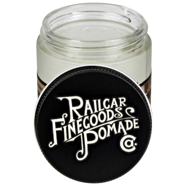 Open jar of clear Railcar Pomade Supreme Hold