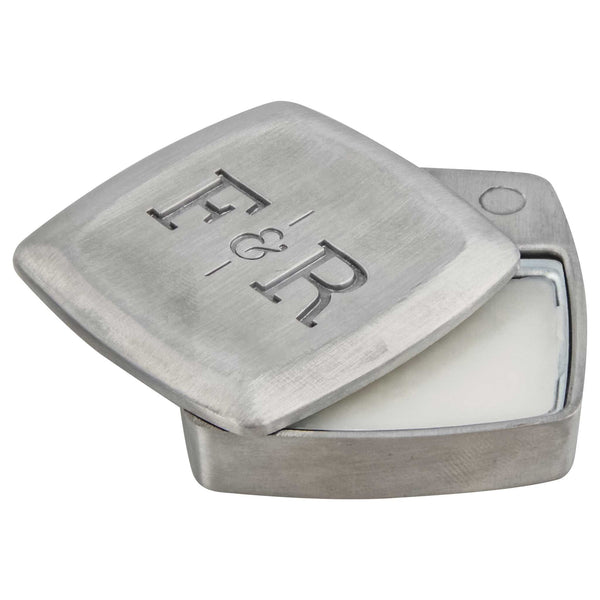 open metal container of solid cologne from fulton & roark