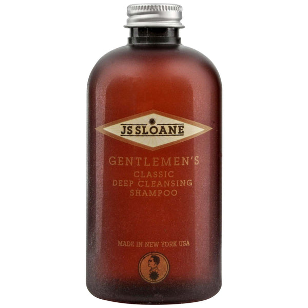 bottle of shampoo from JS Sloane that is deep cleaning without drying